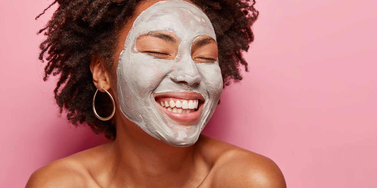 Woman with a bentonite clay mask on her face