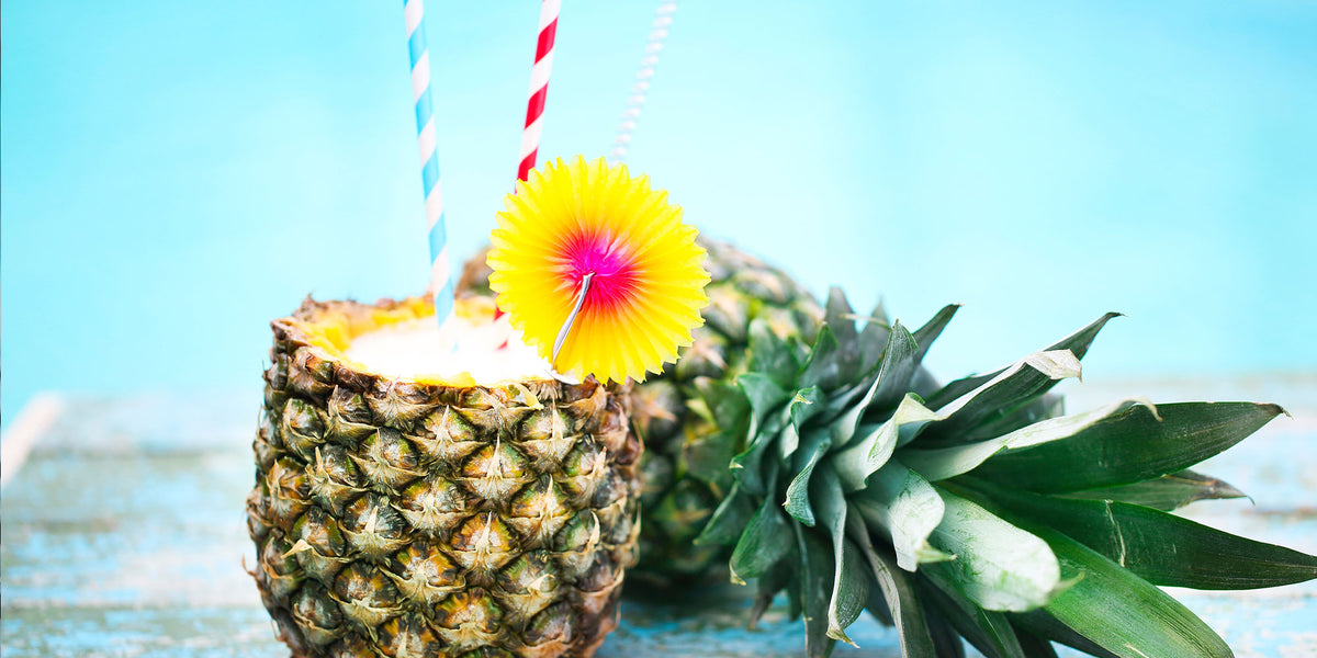 Pina Colada in a pineapple with a straw