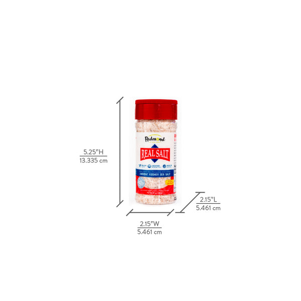 A shaker of Redmond Real Salt, filled with pink ancient sea salt, stands against a white background with size dimensions displayed.