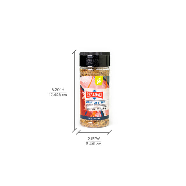 A jar of Real Salt Wasatch Steak seasoning stands against a white background.