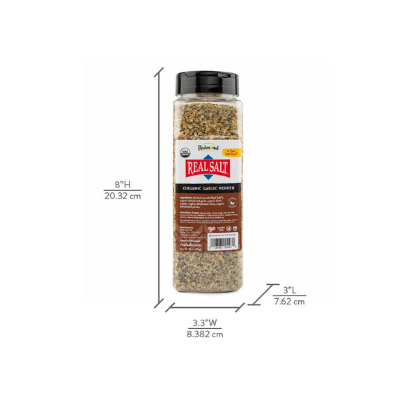 A tall bottle of Redmond Real Salt Organic Garlic Pepper seasoning stands against a white background.