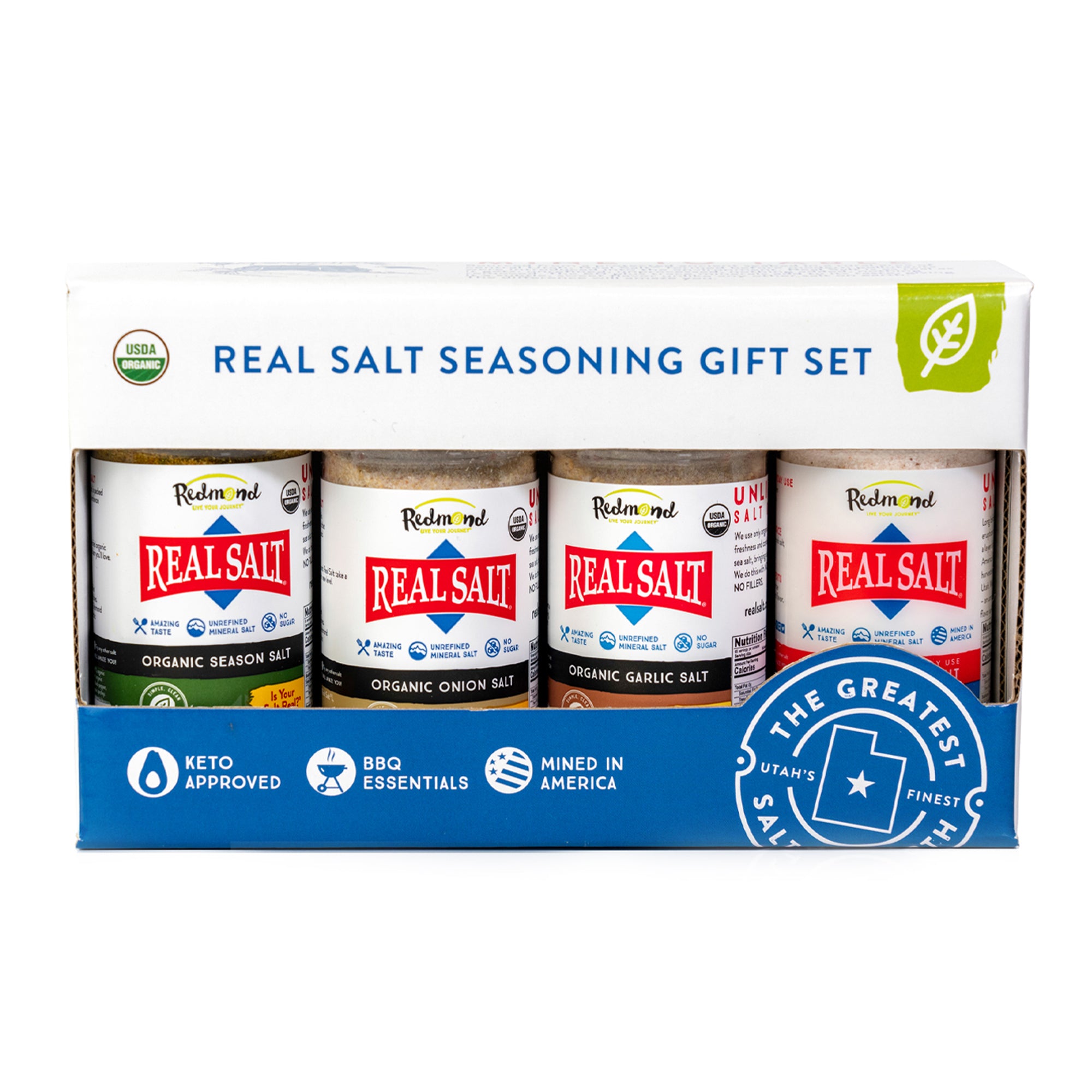 Gift box showcasing four varieties of Redmond Real Salt: Organic Season Salt, Organic Onion Salt, Organic Garlic Salt, and Unrefined Mineral Salt. 
