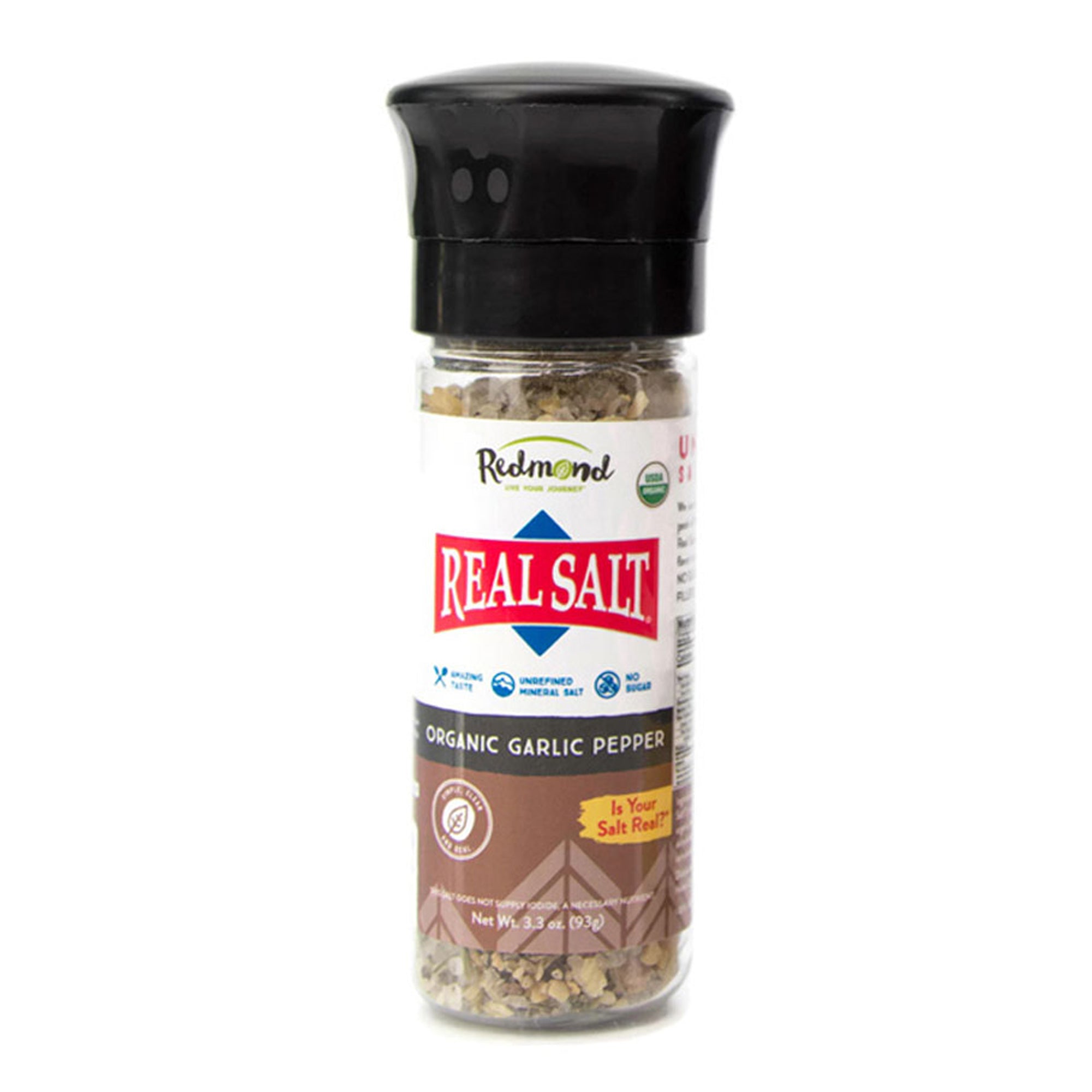 Real Salt Organic Garlic Pepper Grinder 3.3oz on a white background. Redmond Organic Seasonings blend unrefined Real Salt with organic, non-GMO spices and herbs to create gluten-free, sugar-free seasoning blends for roasted vegetables, grilled meats, soups, and more