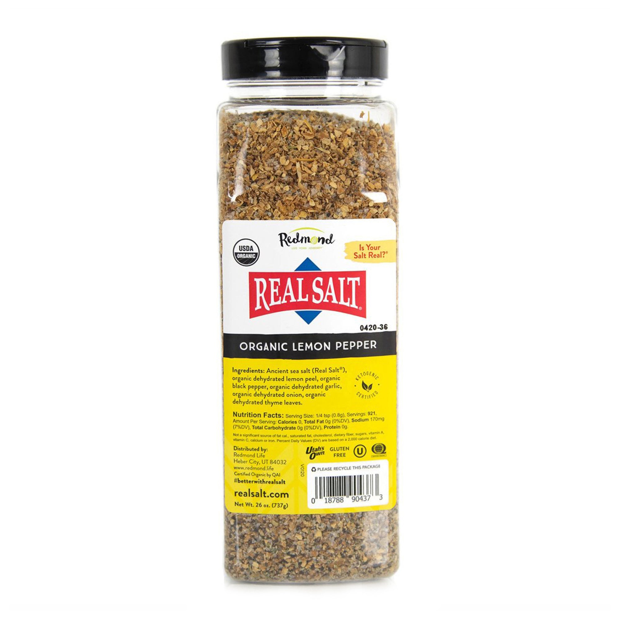 A clear jar displays Redmond Real Salt's Organic Lemon Pepper seasoning, featuring a blend of ancient sea salt, lemon peel, black pepper, garlic, onion, and thyme. 
